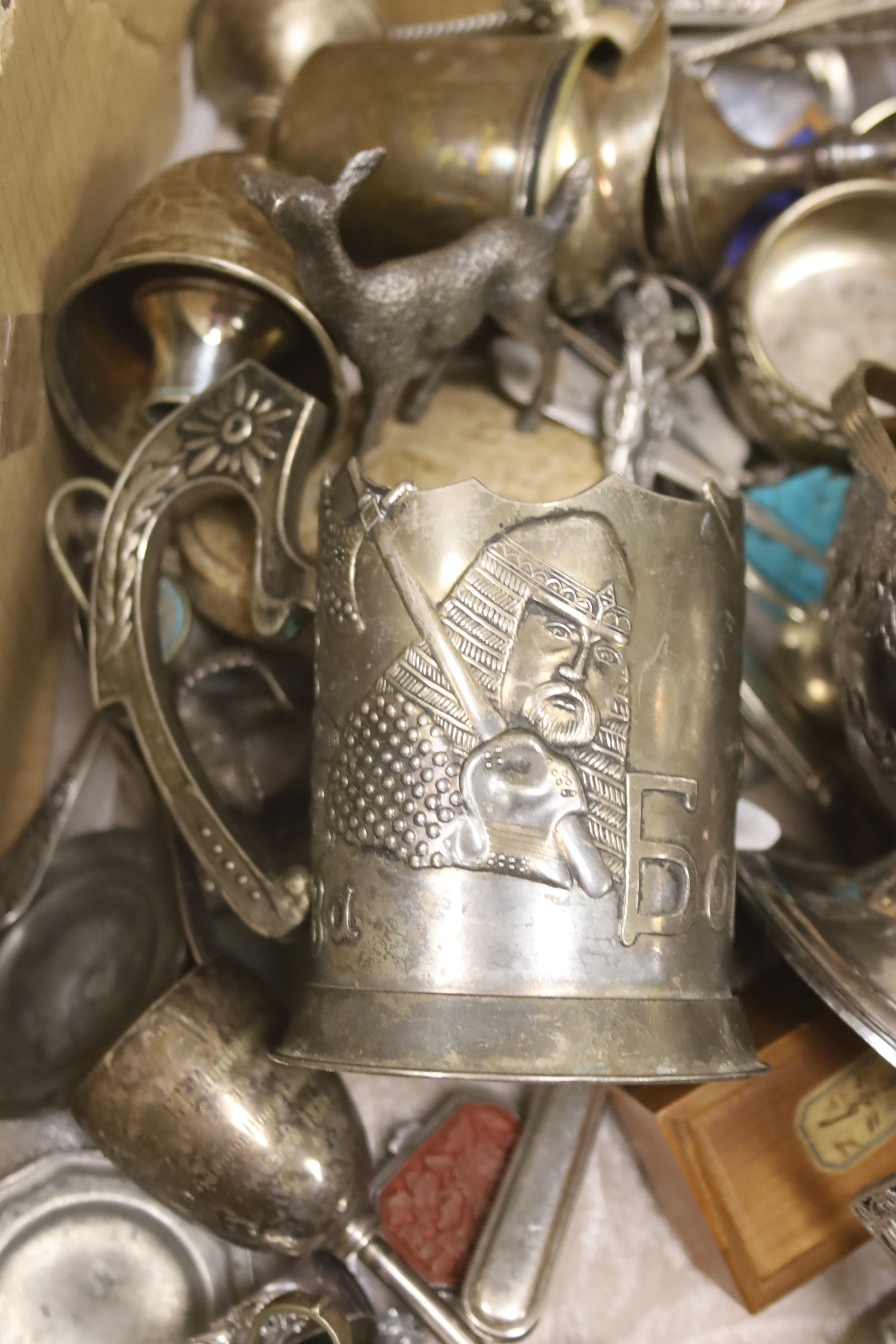 A quantity of plated tableware and cutlery